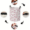 A pink patterned foldable canvas laundry basket with black handles shown from various angles.