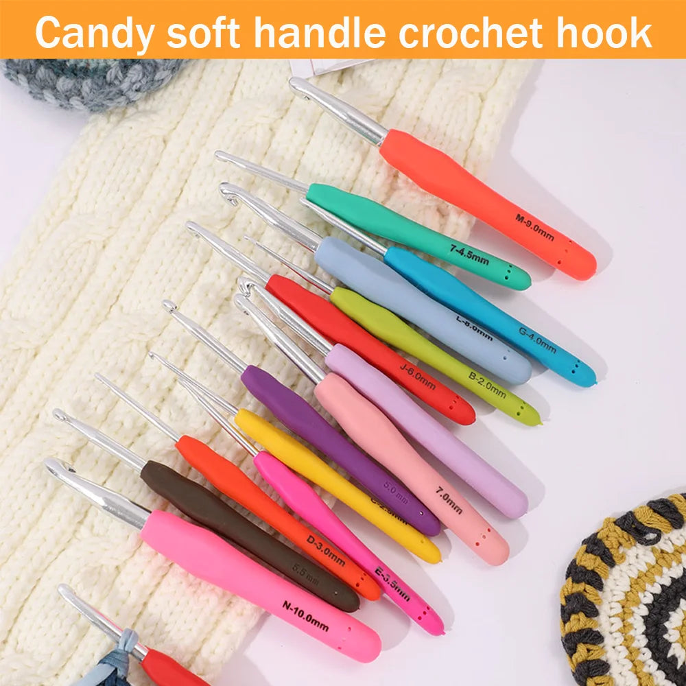 A set of precision aluminum crochet hooks in various colors and sizes displayed on a cream-colored knitted fabric.