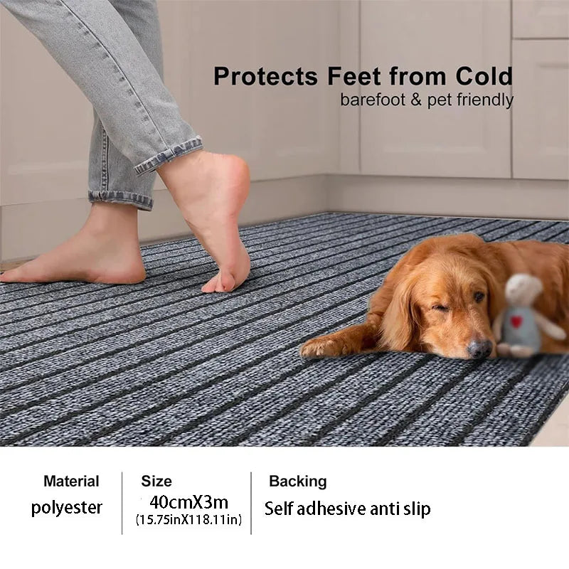 A golden retriever lies on a gray striped runner rug protecting its feet from the cold.