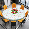 A round elastic-edged vinyl tablecloth set for dining with yellow and black chairs in a modern room.