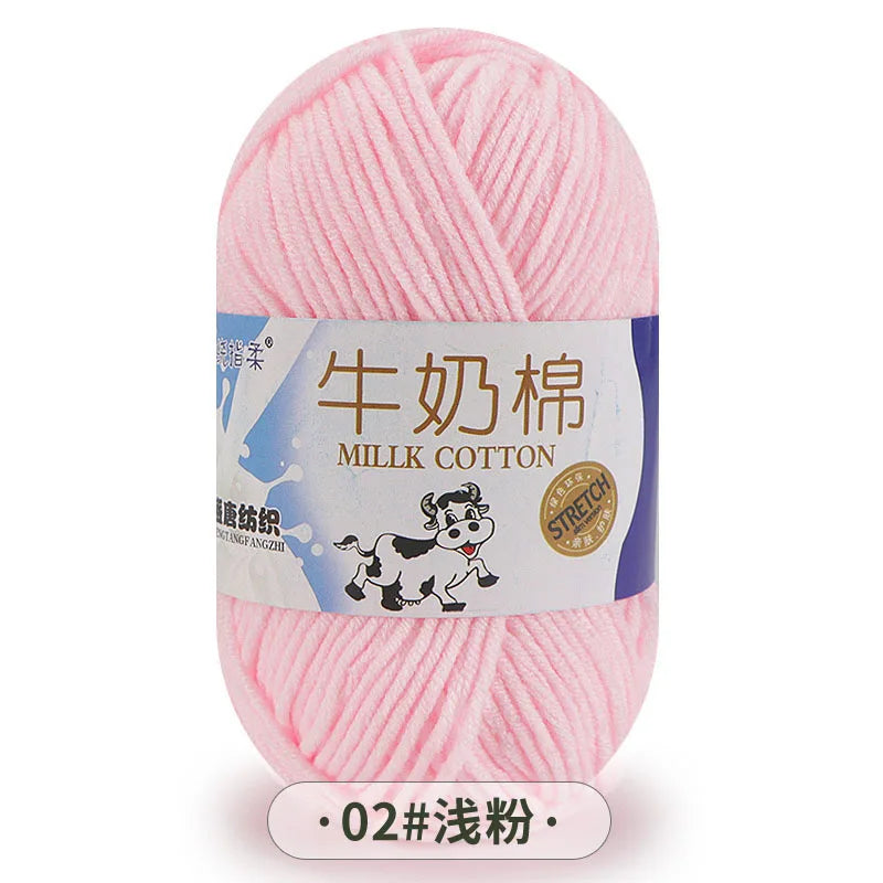 Pink milk cotton yarn skein with Chinese text labeling