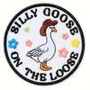 Embroidered hook and loop patch featuring a white goose on the loose design.