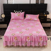 Pink floral bed skirt with ruffled hem protecting a mattress.