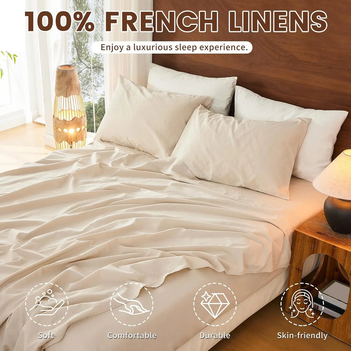 A bed dressed with 100% French linens featuring light beige and white pillows and bedding.