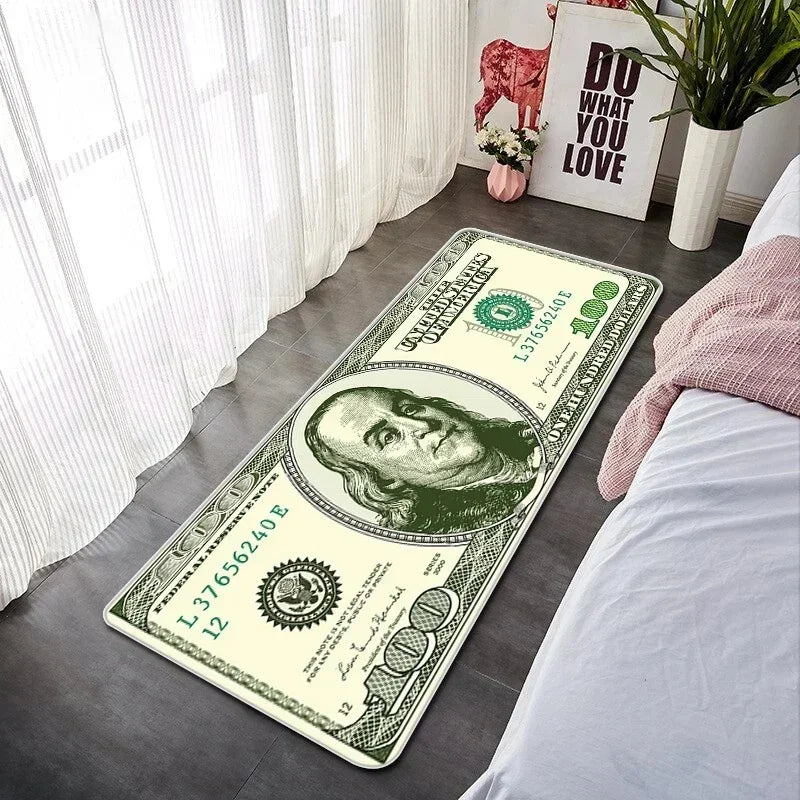 A green US dollar bill lying on a gray floor next to a white curtain and a pink decorative item.