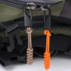 Two detachable zipper pull sliders in gray and orange are shown attached to a dark green fabric bag.