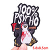 Black embroidery patch featuring a penguin with red markings and the text 100% PSYCHO