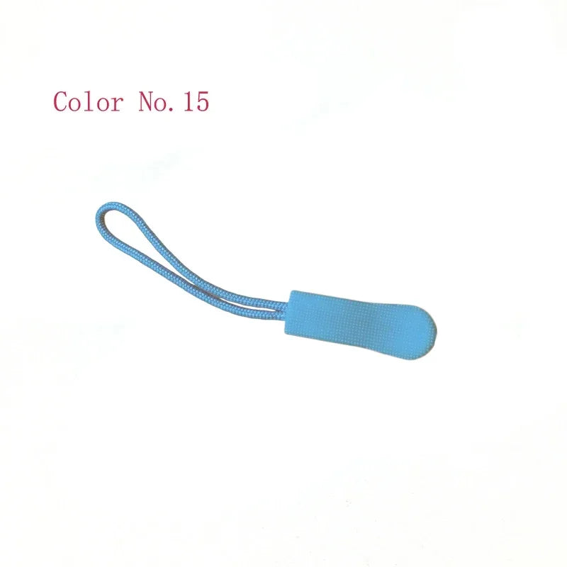 A light blue replacement zipper pull attached to a thin cord.