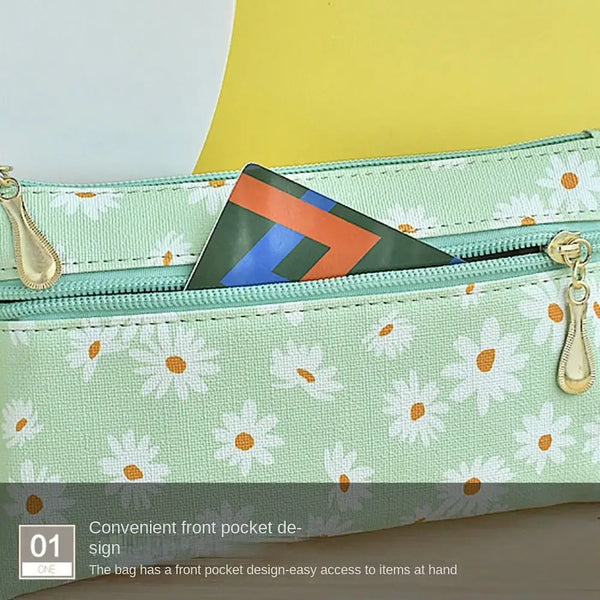 A light green coin purse with a patterned fabric exterior and a triangular flap design.