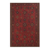 A deep red bohemian Turkish style area rug with intricate geometric patterns.