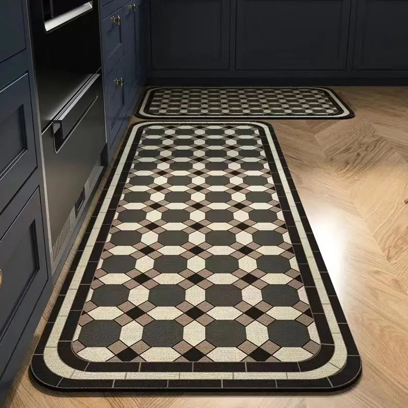 A rectangular floor mat with a black and beige geometric pattern placed on a light wood floor.