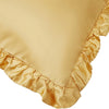 A close-up of a beige ruffled satin pillowcase with a silky envelope closure.