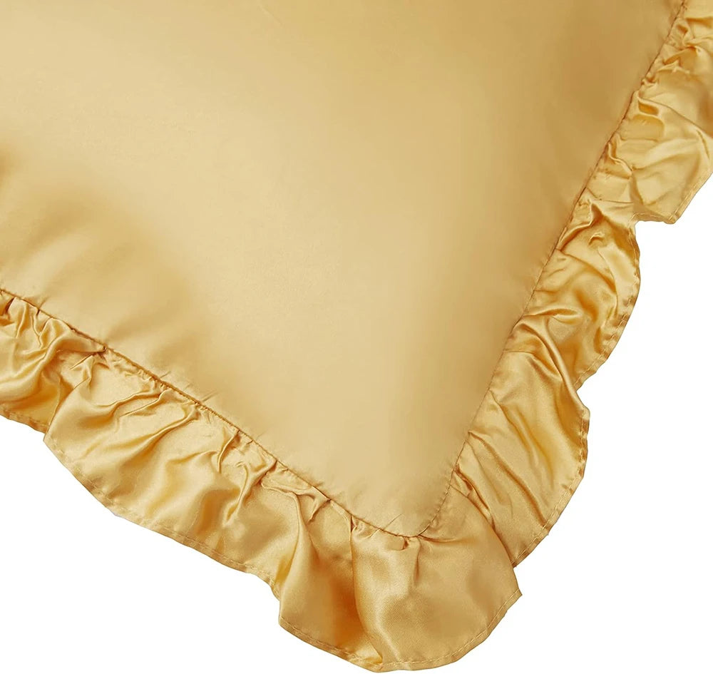 A close-up of a beige ruffled satin pillowcase with a silky envelope closure.