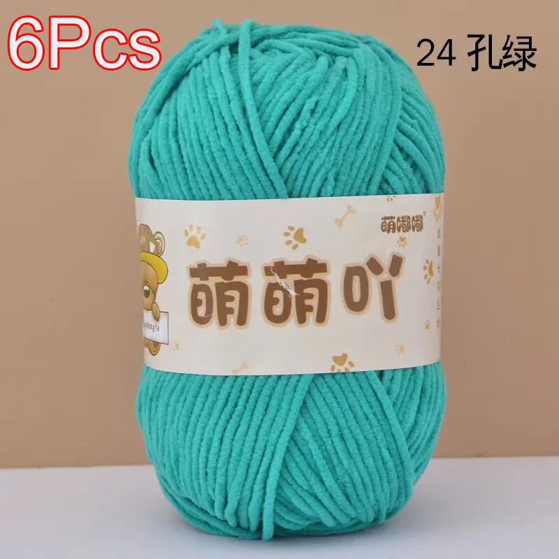 A ball of teal chenille yarn labeled 6pcs and 24 strands for crochet and knitting