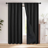 A pair of black blackout curtains hanging on a rod, shown next to a window.