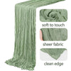 A vertical drape of olive green boho gauze fabric showing soft texture and clean edge.