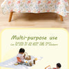 A multi-purpose play mat suitable for use under high chairs, shown being used outdoors.