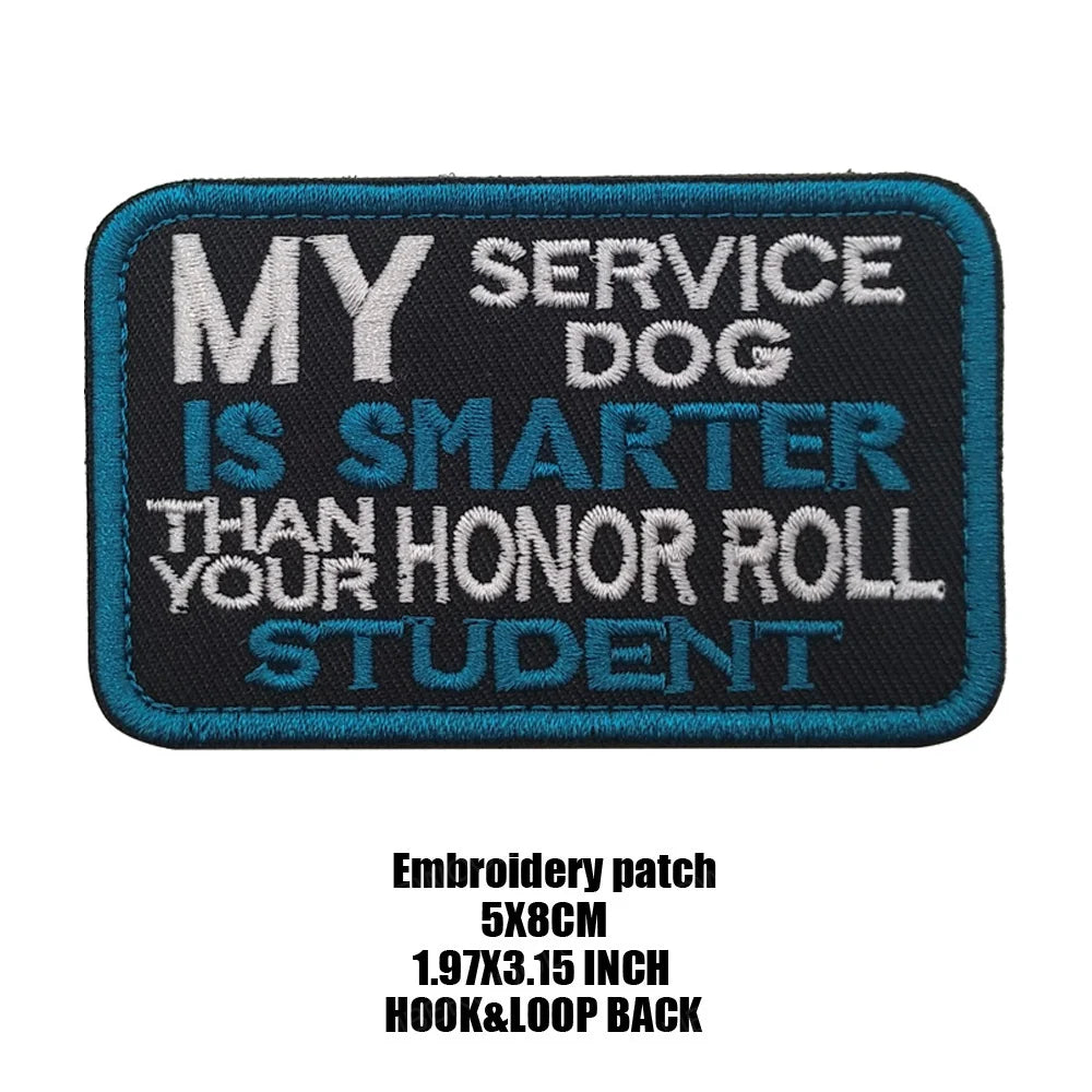Dark blue embroidered patch with white text that reads My service dog is smarter than your honor roll student