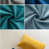 A collection of velvet fabric swatches in shades of teal, blue, gray, and yellow.