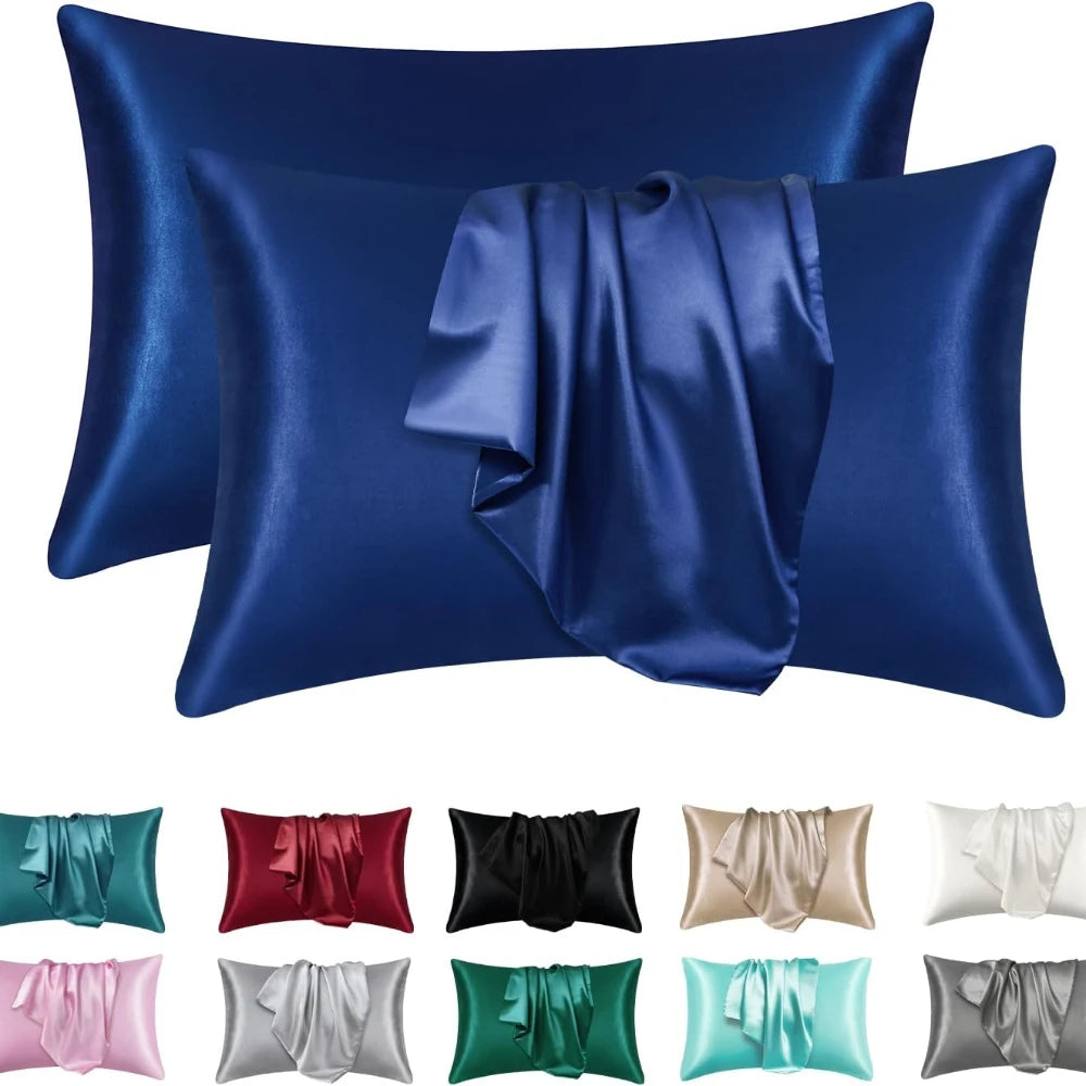 A collection of silky satin pillowcases in various shades including blue, green, pink, and gray.