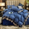 A luxurious navy blue bed skirt set featuring elegant lace edging and layered bedding on a bed.