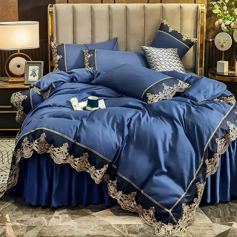 A luxurious navy blue bed skirt set featuring elegant lace edging and layered bedding on a bed.