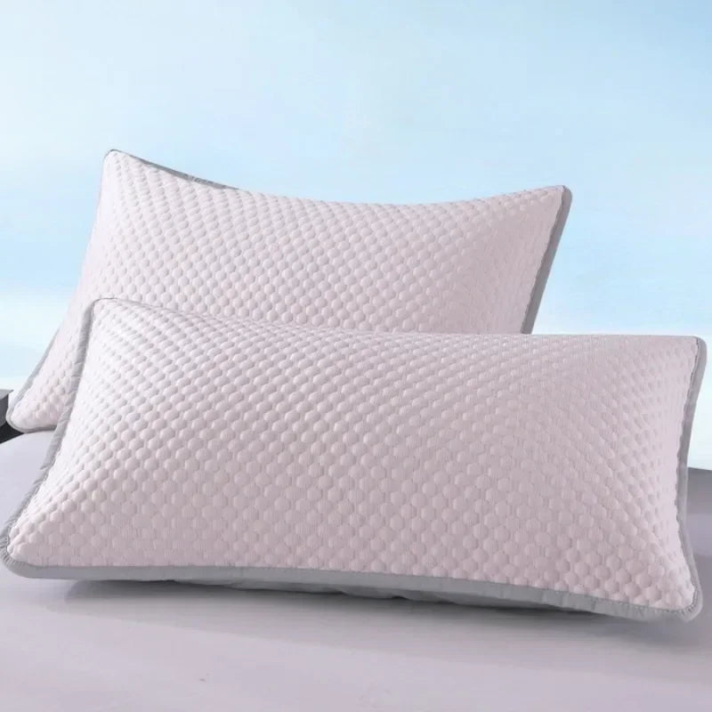 A white quilted ice silk cooling pillowcase is shown against a light blue background.