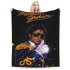 A black blanket featuring a graphic of Michael Jackson and a blonde woman.