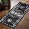 A black and white printed dollar pattern long runner carpet featuring a portrait of a historical figure.