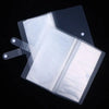 A clear plastic photo storage card album with a protective sleeve and a handle.