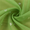 Flowing lime green tulle fabric with scattered silver stars