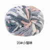 A ball of chunky acrylic yarn featuring a mix of gray, white, and pink fibers.