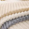 A close-up of a plush anti-slip sofa seat cushion cover in various shades of beige, cream, and gray.