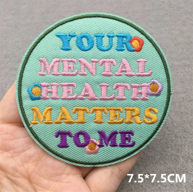 A round embroidered patch with the text Your Mental Health Matters to Me in various colored thread.