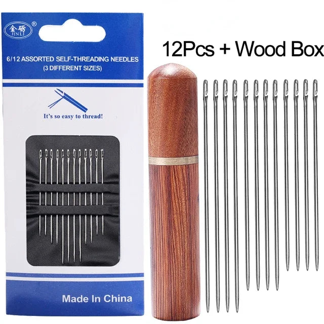 A set of 12 assorted self-threading stainless steel sewing needles packaged in a wooden box.