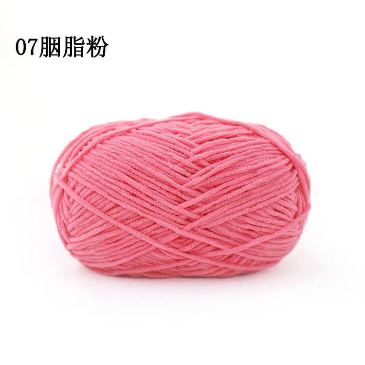 Pink chenille yarn ball used for knitting and crochet projects