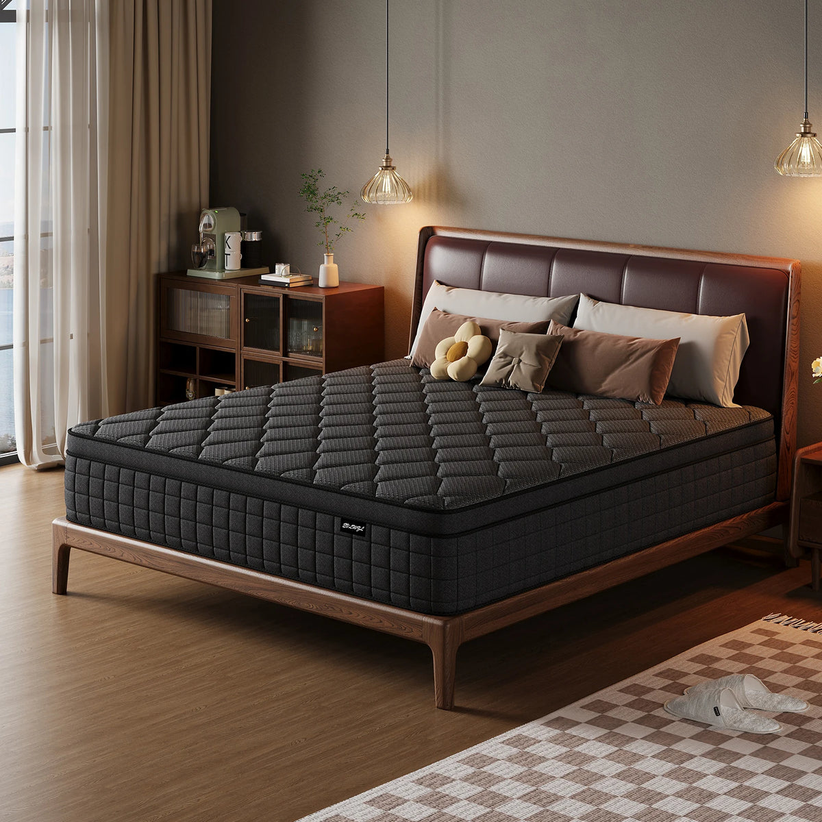 A dark gray hybrid memory foam and pocket spring mattress resting on a wooden bed frame in a modern bedroom.