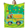 A green flannel throw blanket featuring a cartoon of a vintage van with Scooby-Doo and Shaggy.