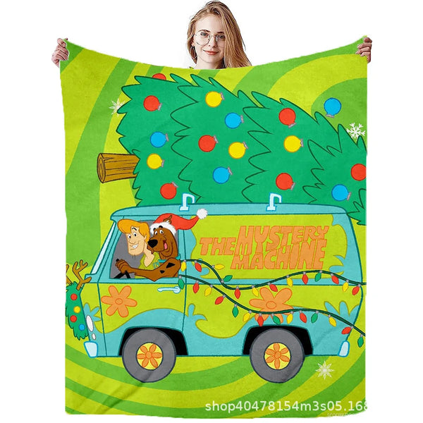 A green flannel throw blanket featuring a cartoon of a vintage van with Scooby-Doo and Shaggy.