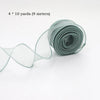 A roll of sheer, silvery-green silky organza ribbon measuring 4 x 10 yards.