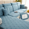 A light blue jacquard plush sofa cushion cover featuring an intricate diamond pattern on a sectional sofa.