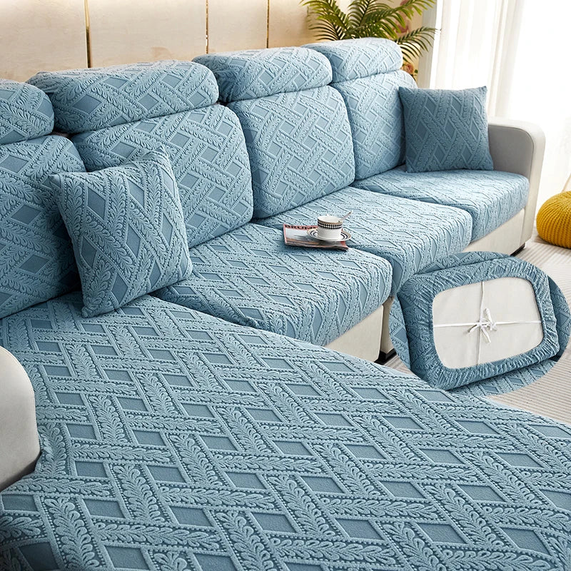A light blue jacquard plush sofa cushion cover featuring an intricate diamond pattern on a sectional sofa.