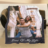 A personalized photo frame blanket featuring a couple smiling in an urban setting.