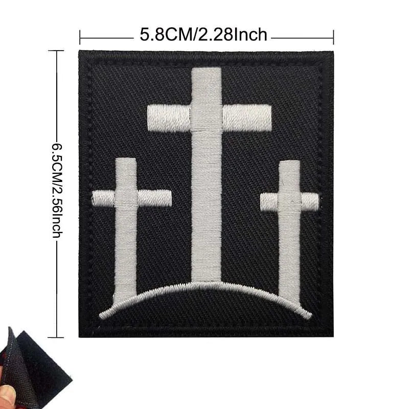 Black embroidered patch set featuring three crosses arranged in a crown design