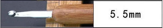 A close-up view of a silver crochet knitting needle with a wooden handle, labeled as 5.5mm.