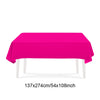 A vibrant pink rectangular tablecloth displayed on a white table.