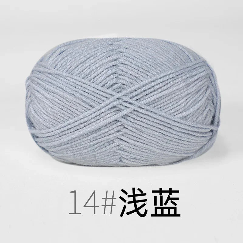 A ball of light gray knitting yarn labeled 14# 浅蓝.