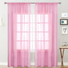 Pink sheer curtain with rod pocket hanging over a white window.