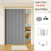 Grey folding single curtain with magnetic poles shown in a doorway.