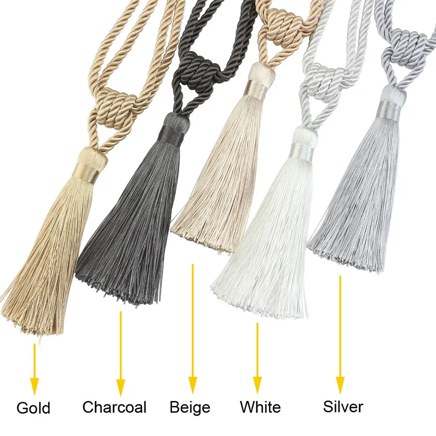 A collection of elegant curtain tiebacks featuring tassels in Gold, Charcoal, Beige, White, and Silver.